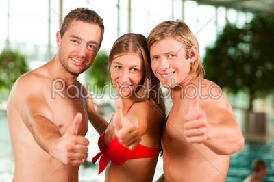 Three friends in public swimming pool