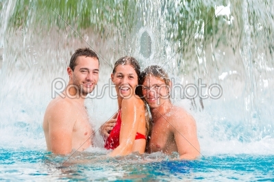 Three friends in public swimming pool