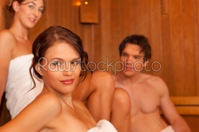 Three people or friends in sauna