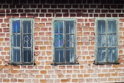 Three windows in a train yard at chama   