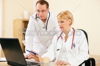 Two doctors discussion documents or test results