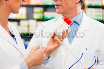 Two pharmacists in pharmacy consulting