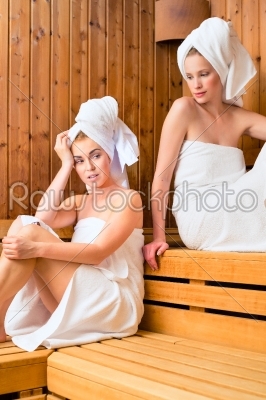 Two women in wellness spa enjoying sauna infusion