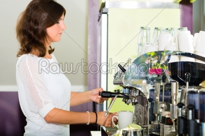 Waitress in cafe making coffee
