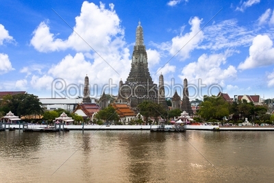 Wat Arun (Temple of Dawn) Across Chao Phraya River With Blue Sky