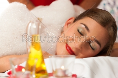 Wellness - woman getting foam massage in Spa