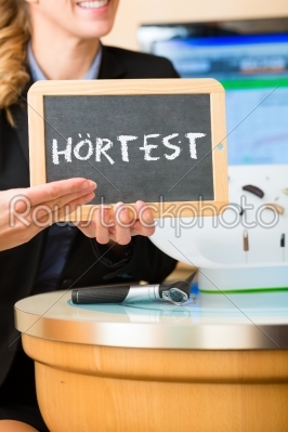 Woman advertising a hearing test