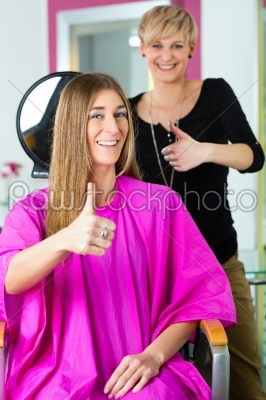 Woman at the hairdresser getting advise