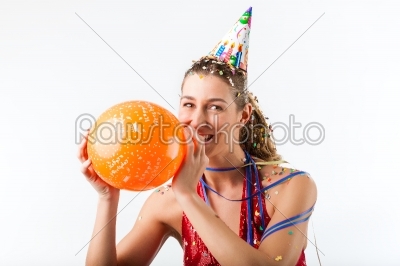 Woman celebrating birthday with balloon