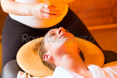 Woman enjoying a Ayurveda oil massage