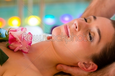 Woman enjoying head massage in a spa