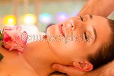 Woman enjoying head massage in a spa