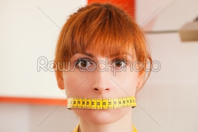 Woman gagged by a tape measure