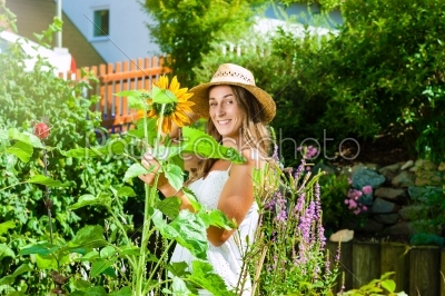 Woman gardener standing in the garden