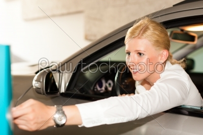 Woman getting into her car