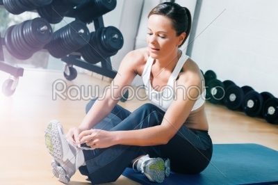 Woman getting ready for training in gym