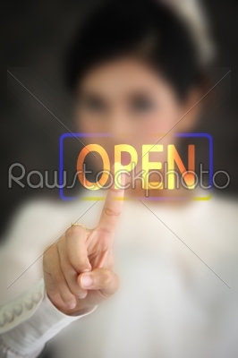 woman hand pressing open button on a touch screen 