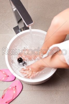 Woman having hydrotherapy water footbath