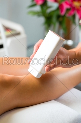 Woman in Spa getting leg waxed