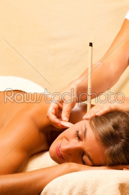 Woman in therapy with ear candles