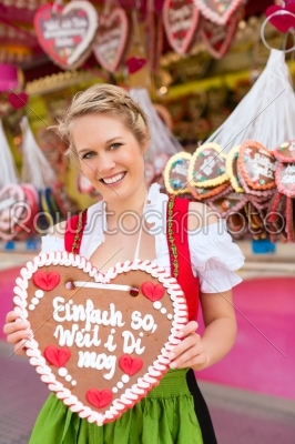 Woman in traditional Bavarian clothes or dirndl on festival