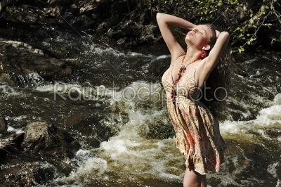 Woman near a waterfall