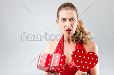 Woman opening the gift and is disappointed