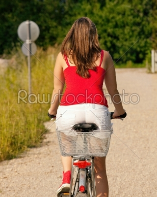Woman riding her bicycle in summer