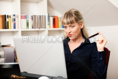 woman shopping online via Internet from home