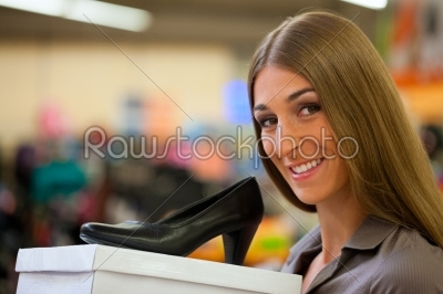 Woman shopping shoes in store