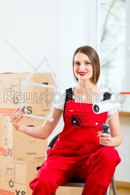 Woman with moving box in her house