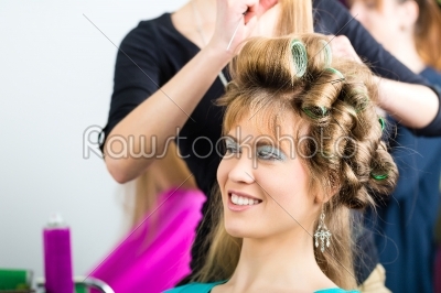 Women at the hairdresser being curled