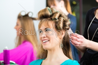 Women at the hairdresser with curls