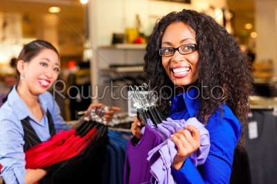Women in a shopping mall with clothes