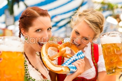 Women with traditional Bavarian clothes in beer tent