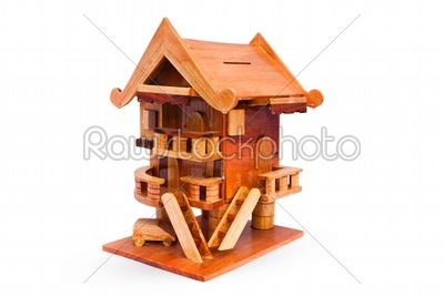 Wooden house piggy bank