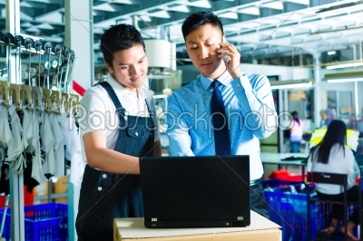 Worker and customer service of a factory
