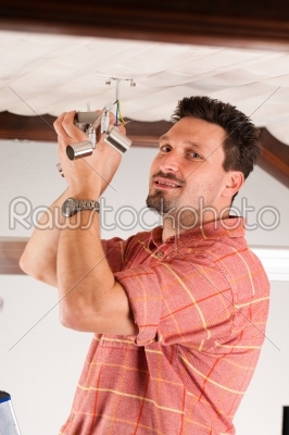 Worker is installing a luster