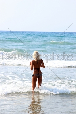 Young beautiful woman on a beach