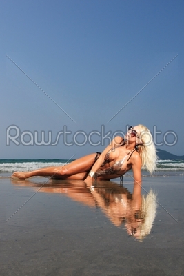 Young beautiful woman on a beach
