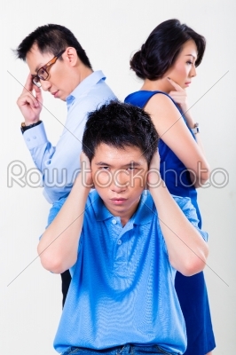 Young Chinese boy suffering from parents divorce