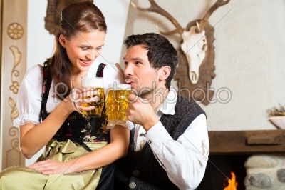 Young couple in a hunters cabin