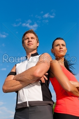 Young couple is doing sports outdoors