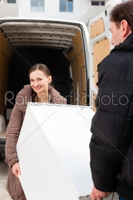 Young couple loading a moving truck