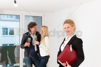 Young couple looking for real estate with female realtor