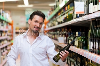 Young Man Shopping for Liquor
