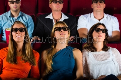young people strained watching 3d movie at movie theater