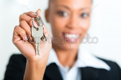 Young realtor with keys in an apartment