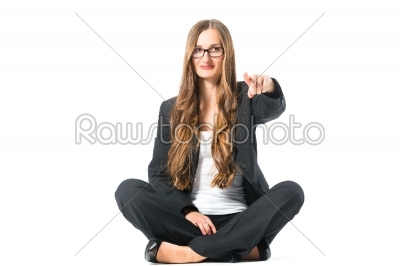 Young self confident business woman pointing