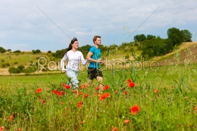 Young sportive couple is jogging outside